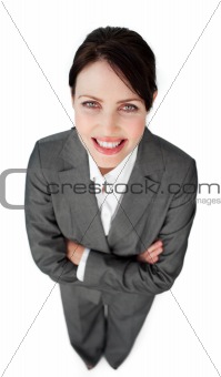 Portrait of a sparkling businesswoman with folded arms 