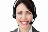 Bright female executive with headset 