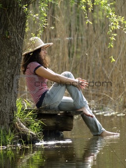 Girl resting near lake