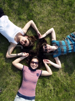 Girls laying on grass