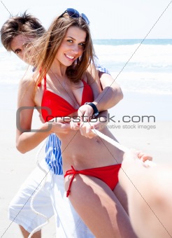 Happy Smiling Couples pulling a rope