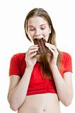 young woman enjoying chocolate bar 