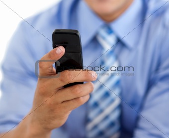 Close-up of a businessman sending a text