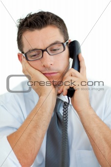 Young businessman sleeping on phone 