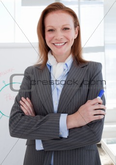 Attractive businesswoman in front of a white board
