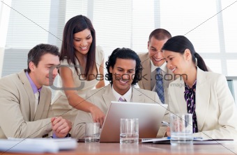 Cheerful business partners working at a computer