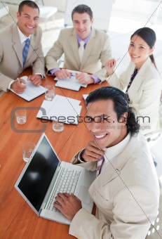 Confident business co-workers in a meeting