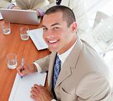 Smiling young businessman in a meeting