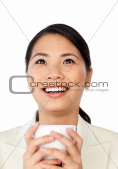 Happy businesswoman drinking coffee 