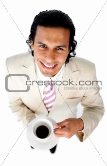 Smiling ethnic businessman drinking a coffee 