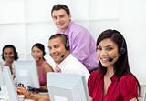 Positive business people with headset on working 