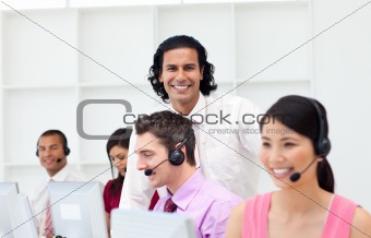Smiling manager checking his employee's work