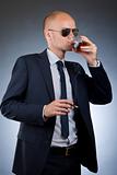 young businessman drinking and smoking