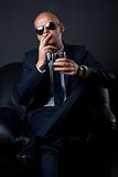 businessman smoking and drinking