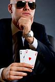 businessman holding a poker hand