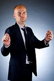businessman holding an imaginary sign