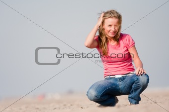 Young woman on sea shore