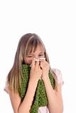 Sick, young girl blows her nose