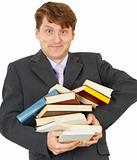 Happy man holding pile of books