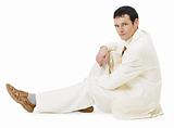 Man in light business suit siting on white