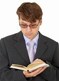 Guy with glasses reading scientific book