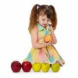 Little girl on white background with apples