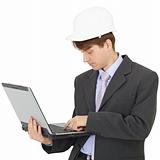 Builder works with laptop holding it on hands