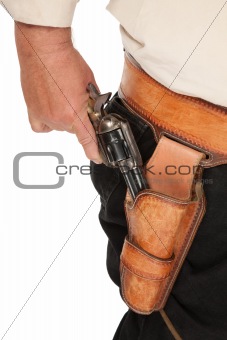 A cocked pistol pulled out of a leather holster