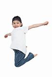 Little boy jumping on isolated white background