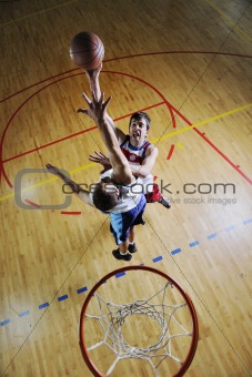 young men playing basketball