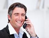 Handsome mature businessman talking on phone