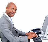 Handsome businessman working at a computer 