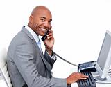 Smiling Afro-American businessman talking on phone