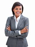 Positive businesswoman with folded arms standing