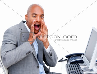 Afro-american businessman yelling sitting at his desk