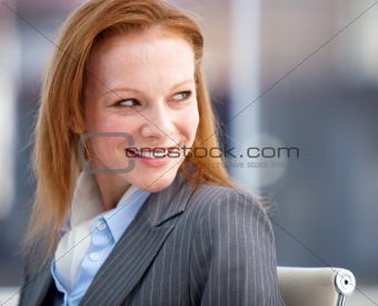 Nice business woman looking behind her