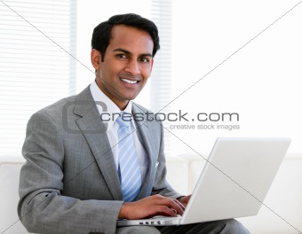 Confident businessman working on his computer