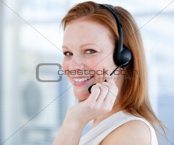 Smiling sales representative woman with an headset
