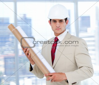 Handsome architect holding a blueprint  