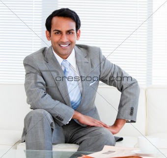 Handsome businessman sitting on the sofa