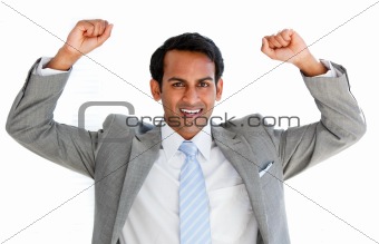 Happy businessman punching the air 
