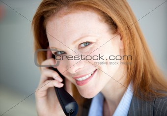 Self-assured business woman taking a call
