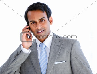 Happy businessman taking a phone call 