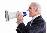 Senior smiling businessman using a megaphone 