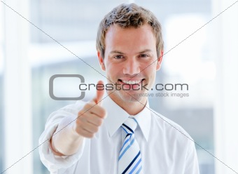 Portrait of a cheerful businessman with a thumb up