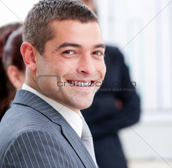 Close-up of a smiling businessman at a presentation