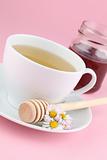 Herbal tea with daisies and honey