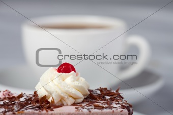 cherry cake and a cup of coffee