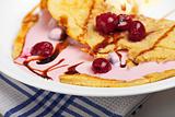 omelet with cherry sauce and vanilla ice