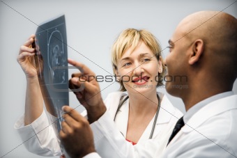 Physicians analyzing xray.
